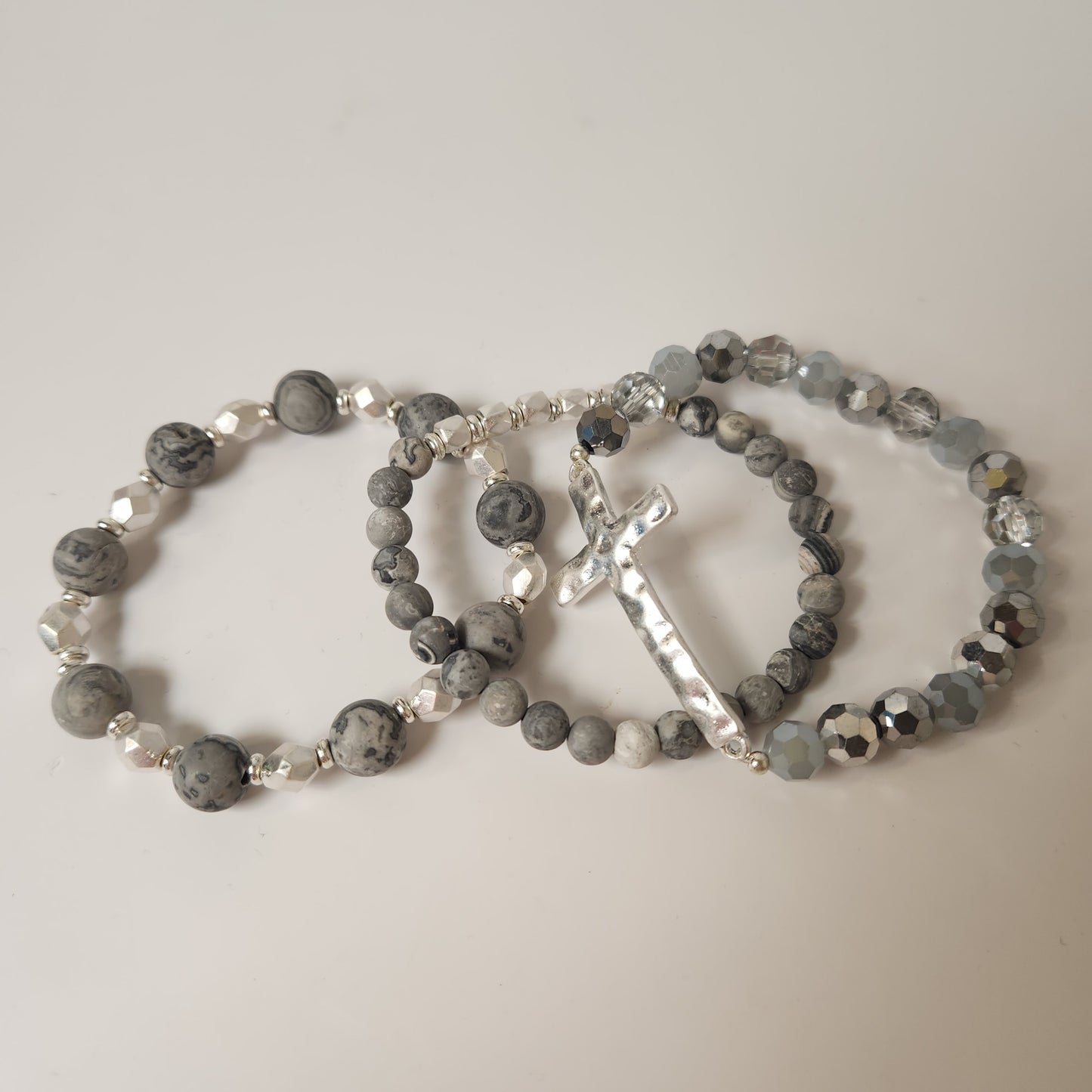 Semi Precious Set of Three Beaded Bracelets With Hammered Cross Focal
